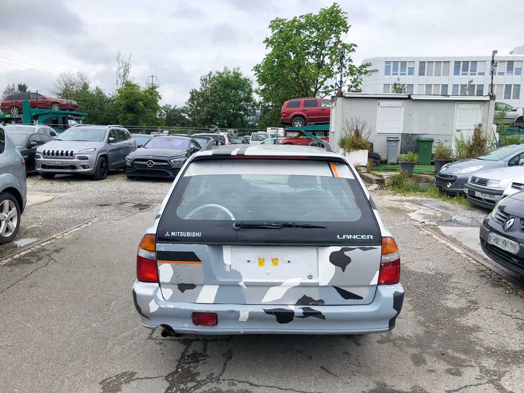 MITSUBISHI Lancer 1.6 GL SwissStar 2001 Benziner Kombi manuell Autoankauf Export Hinterseite